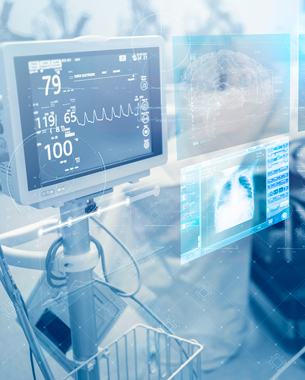 Hospital operating room with medical devices displaying real-time imaging and diagnostics on-screen