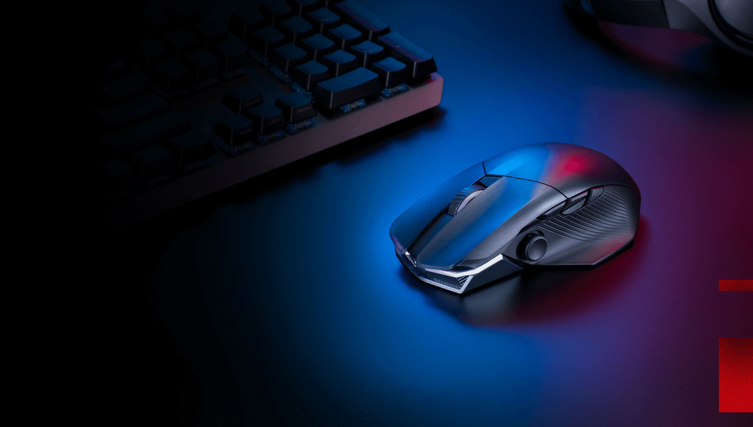 The Chakram X mouse sitting on the table, RGB shining