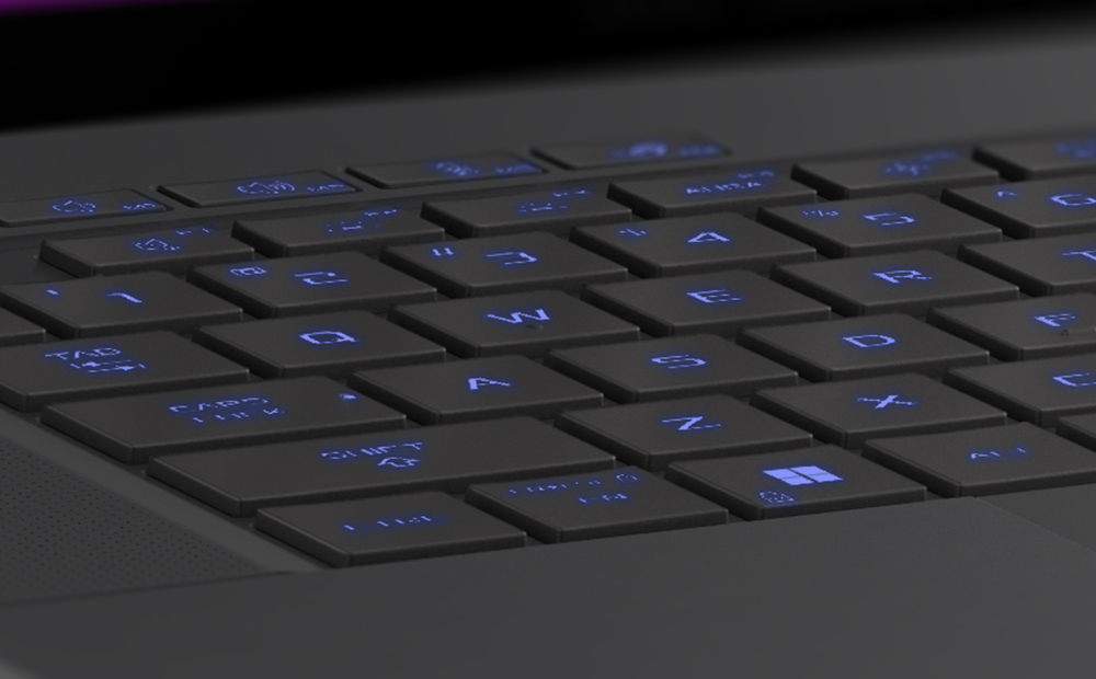 Extreme close up of the WASD keys on the Eclipse Grey Zephyrus G16, with the keys illuminated in blue.
