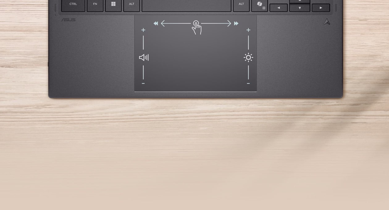 图片从俯视角度显示笔记本电脑的触控板，具有智能手势控制功能。向左滑动可调整音量，向右滑动可控制亮度，向上滑动则可快速滑动视频时间轴。