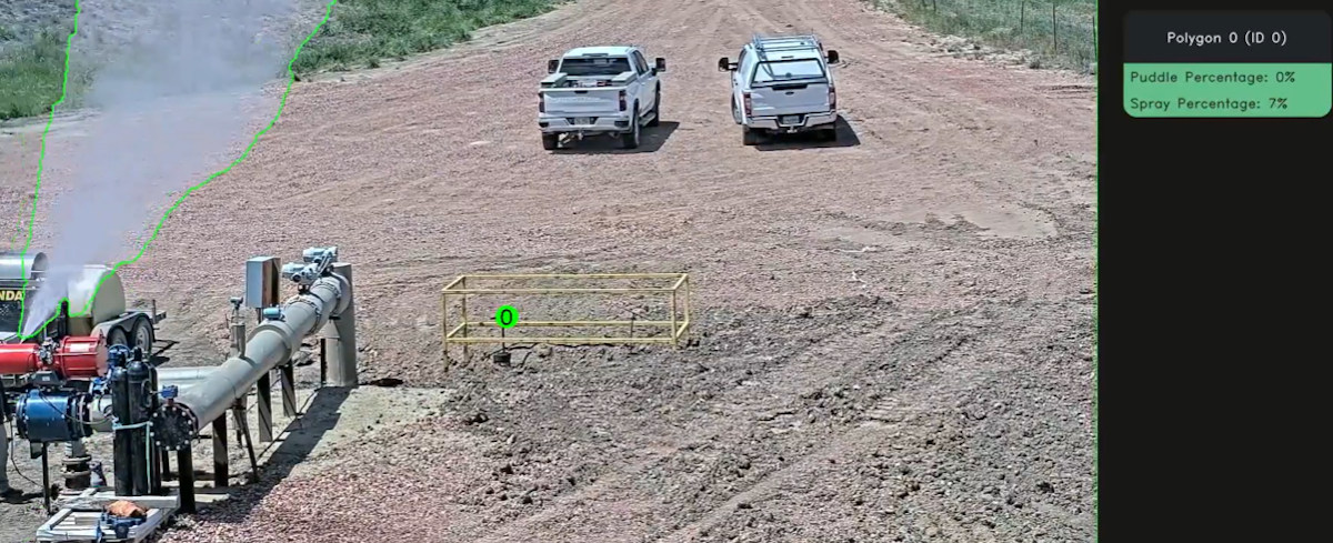 The image shows a spray coming from a machine, outlined in green on a detection interface. Instructions and data are displayed on the right side of the frame.