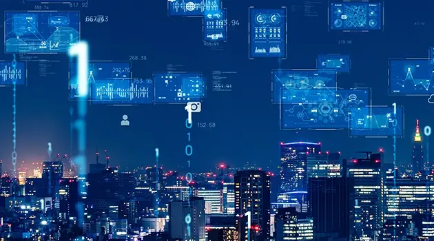 夜幕下的数字化城市景观，建筑群灯火通明。蓝色的全息界面与数据符号悬浮其上，传递出科技与创新的气息。