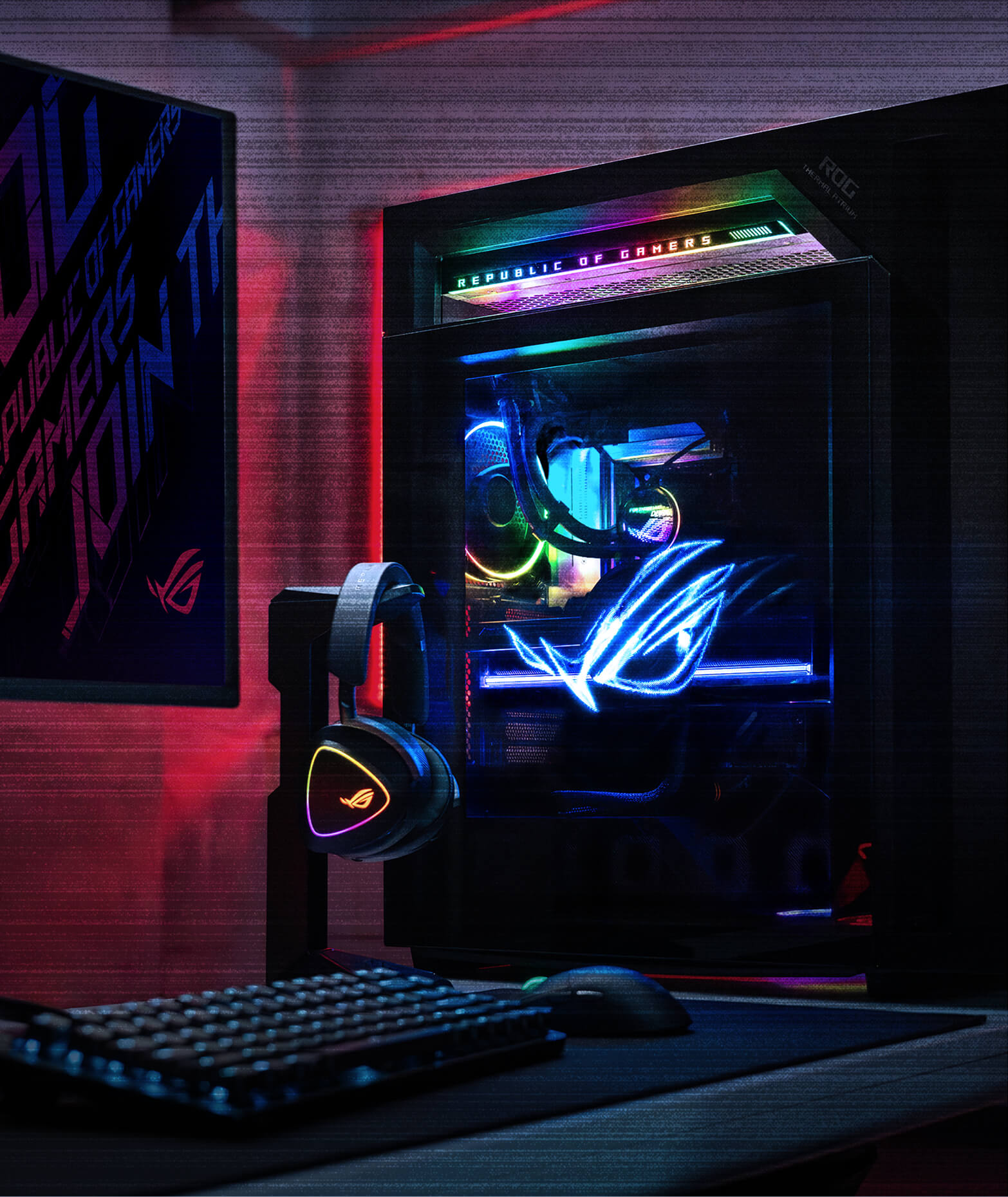 在黑暗的房间里，一台 ROG 枪神 10X 电竞台式机发出 RGB 灯光，旁边放着电竞键盘和耳机，右下角显示 Microsoft Windows 标志。