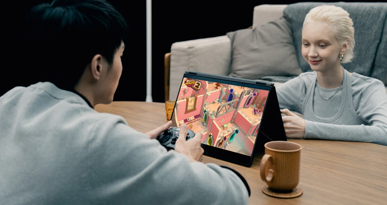 Two people playing a game on the tent mode.