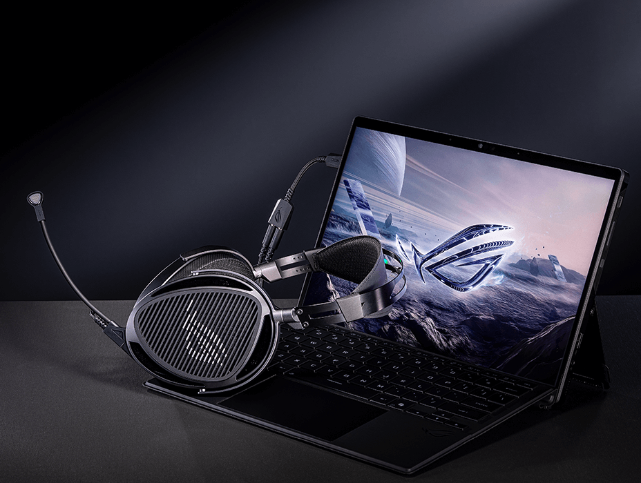 ROG臻世gaming headset connected to a laptop using a USB-C to dual 3.5 mm adapter