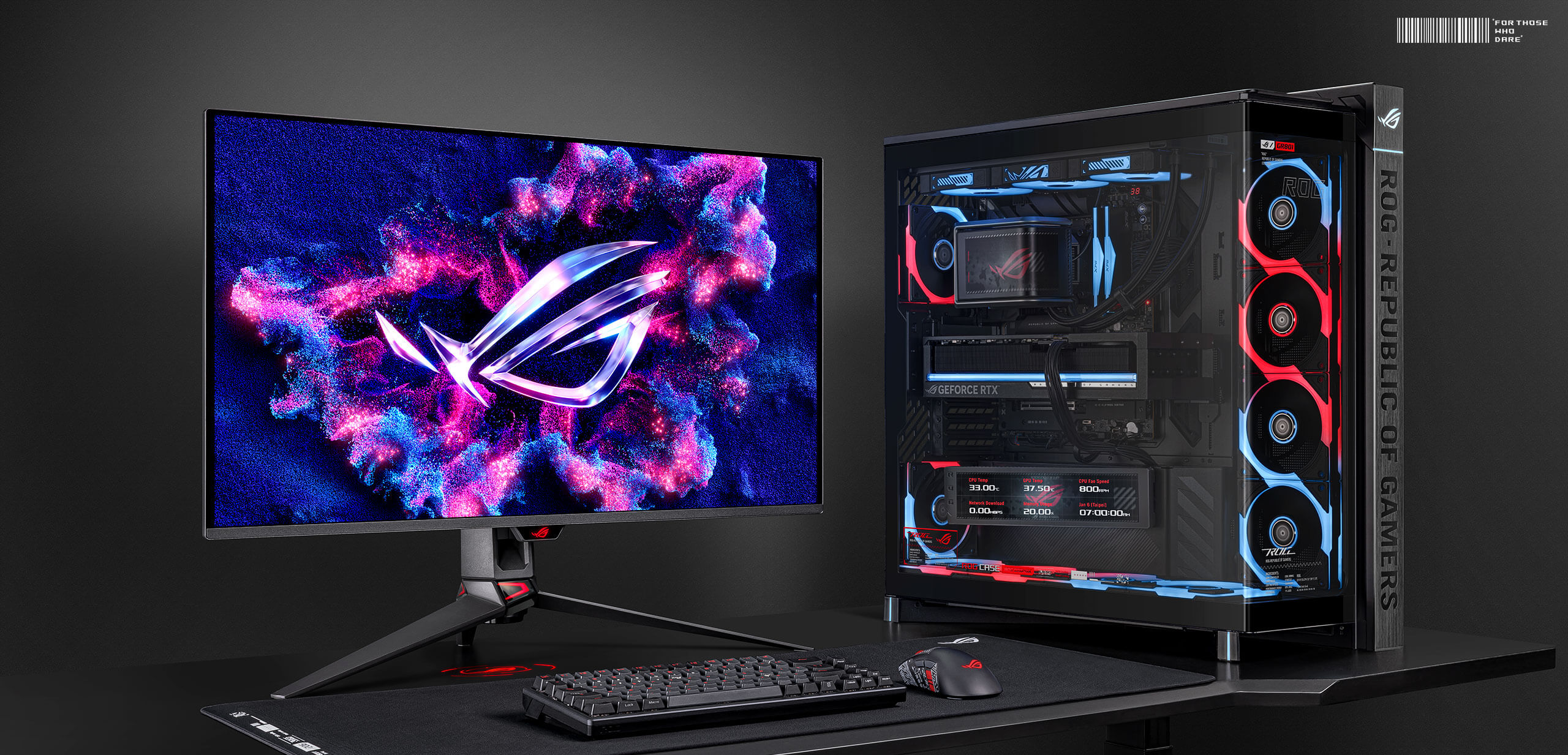 顶级电竞配备情境图，包含 ROG 幻世神主机、显示 ROG 标志的屏幕，以及搭配暗色背景的 ARGB 外围设备