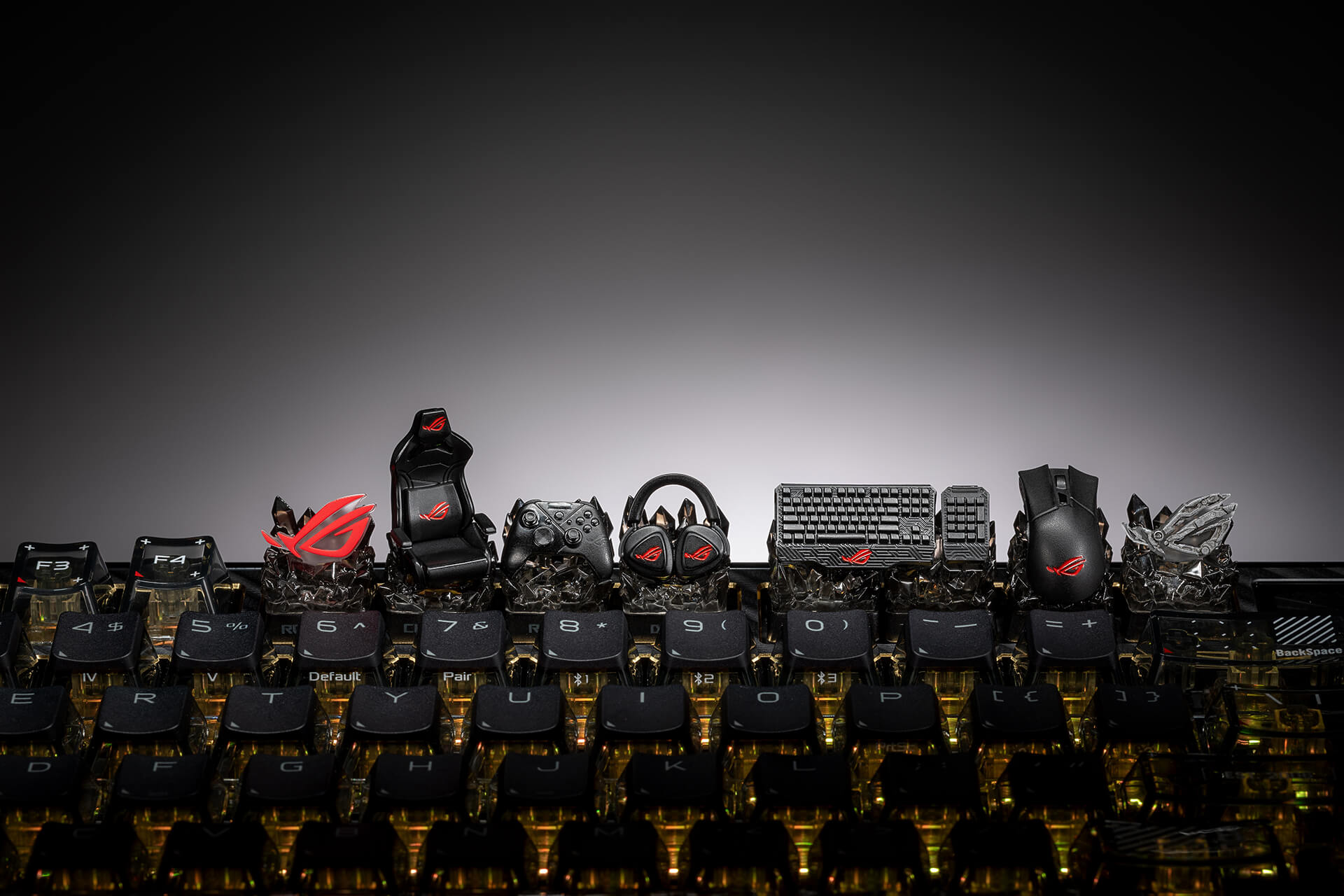 A group photo of the whole set of Keycap Mystery Box Edition 20, placing on the F-row of a keyboard