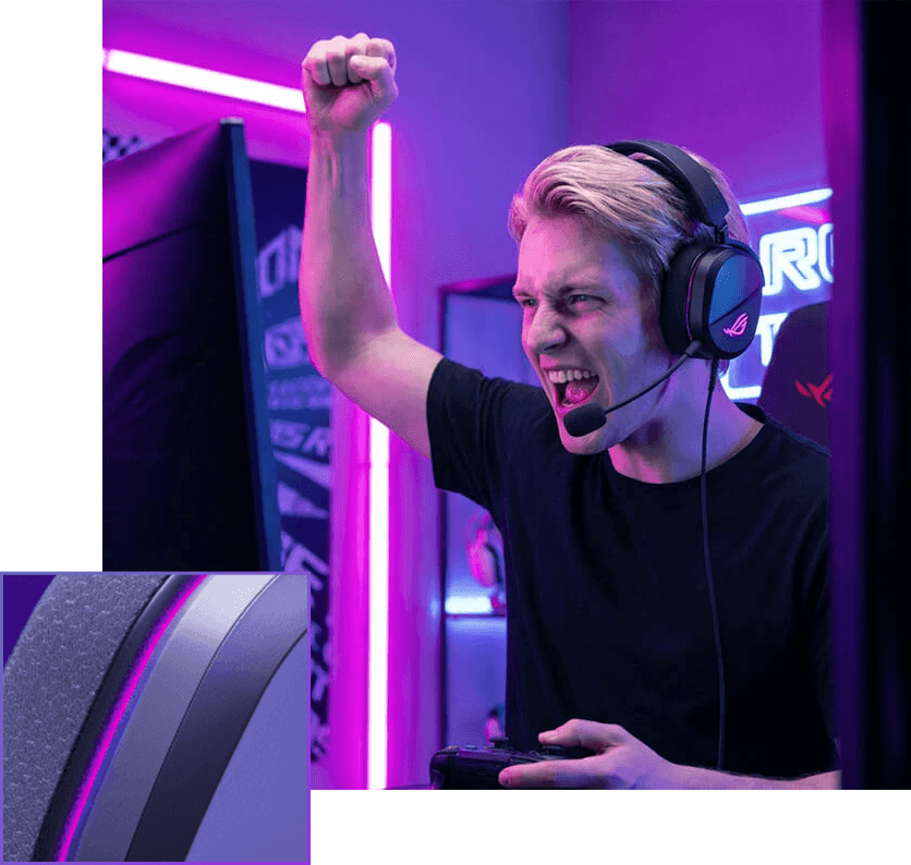 An excited male gamer wearing an ROG 破风 标准版gaming headset, raising his fist to celebrate a win.