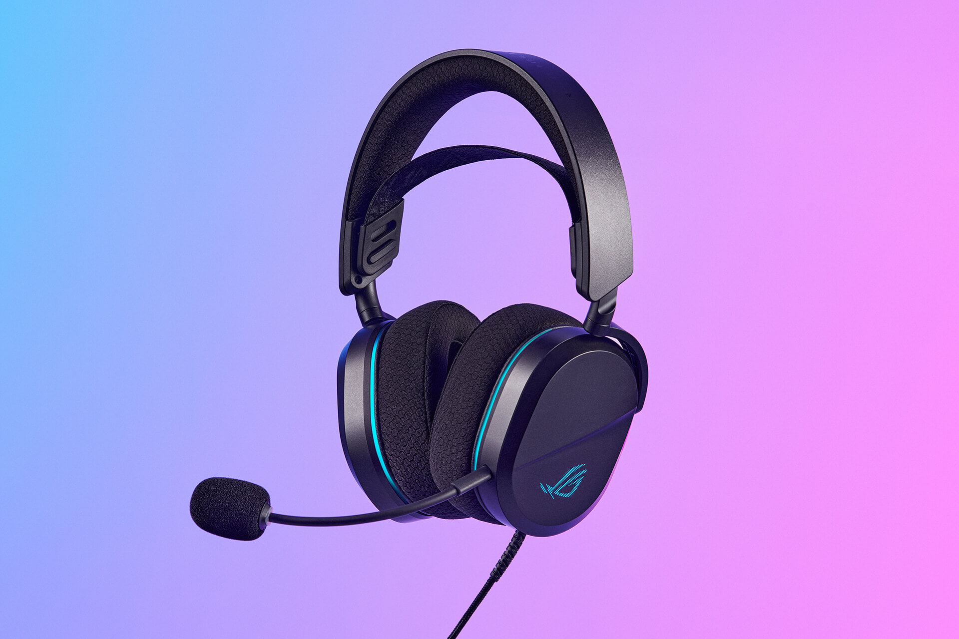 ROG 破风 标准版gaming headset floating in the background with blue and pink lighting backgroun