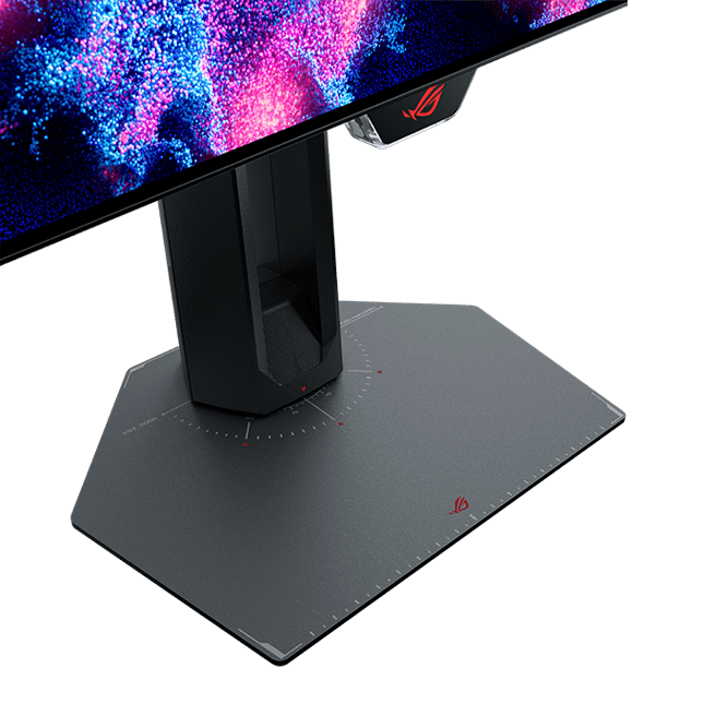 Close-up of the monitor stand base showing a rotation scale with degree markings around the ROG logo, used to measure swivel angle.
