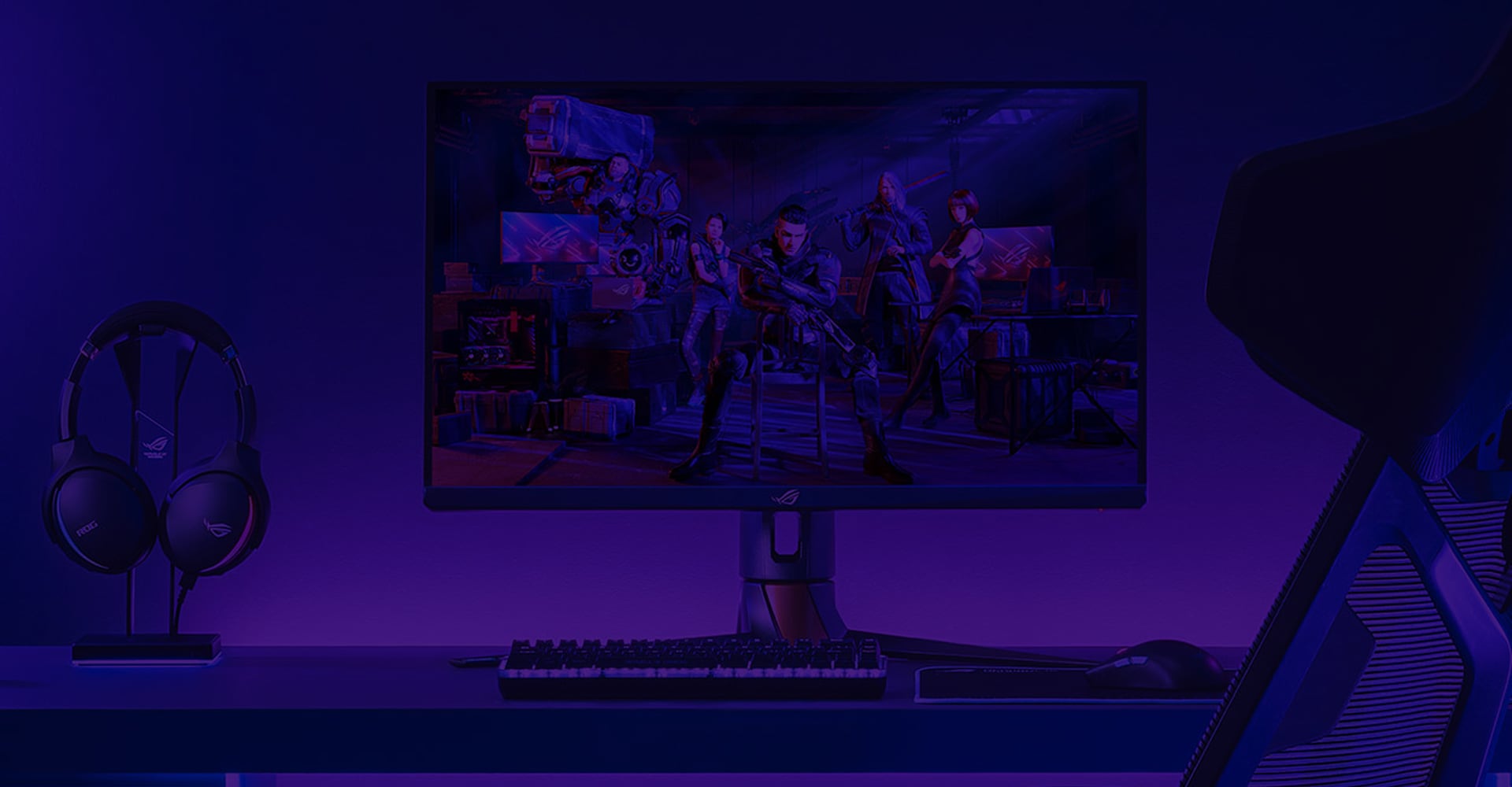 ROG gaming setup with a PC, monitor, keyboard, mouse, and headset.