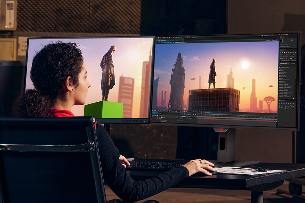 Woman editing a photo on a dual-monitor setup