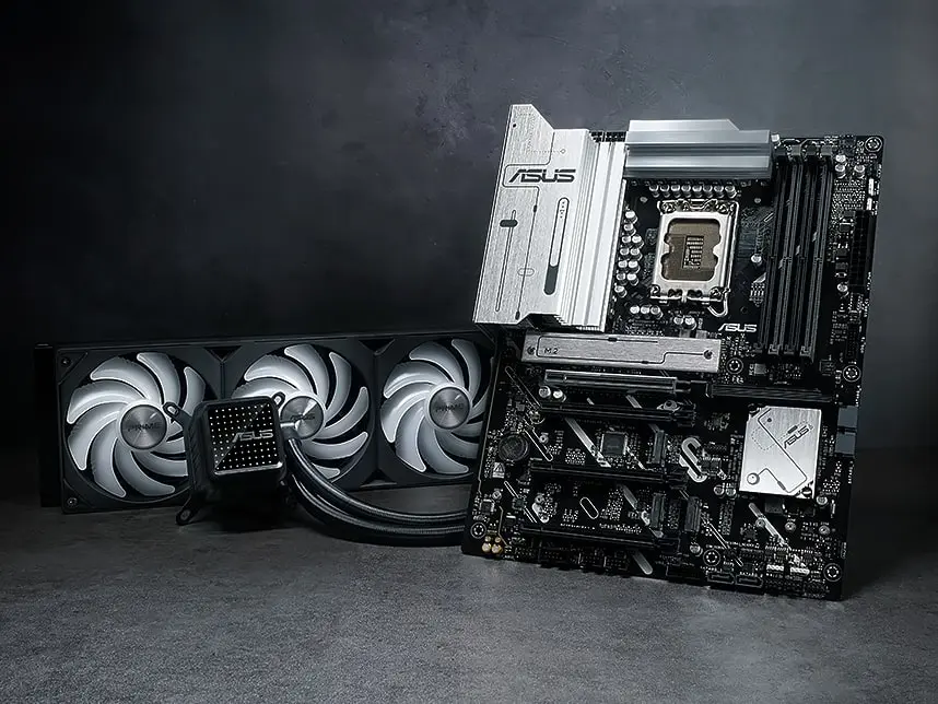 A Prime motherboard and AIO cooler on a table.