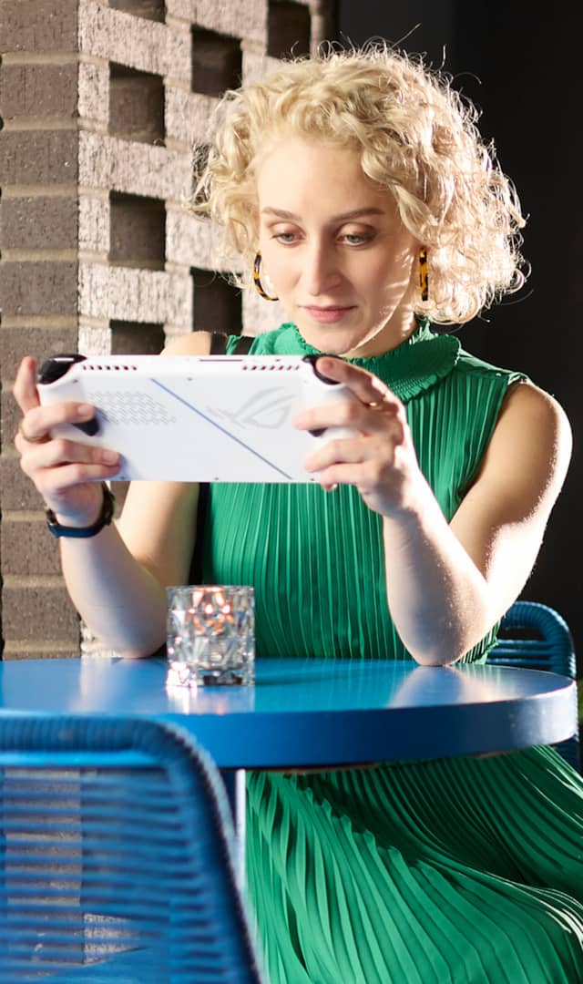 The picture of white woman playing with ROG ALLY