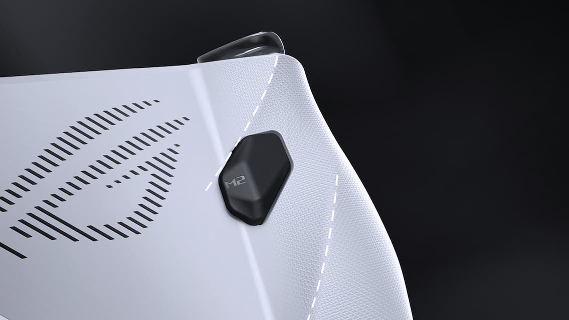 ROG Ally face down on a table, with the M2 button and ROG logo on the air intake visible.