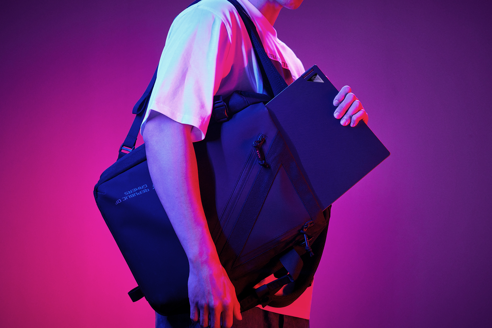 A man putting the ROG Flow X16 inside an ROG backpack