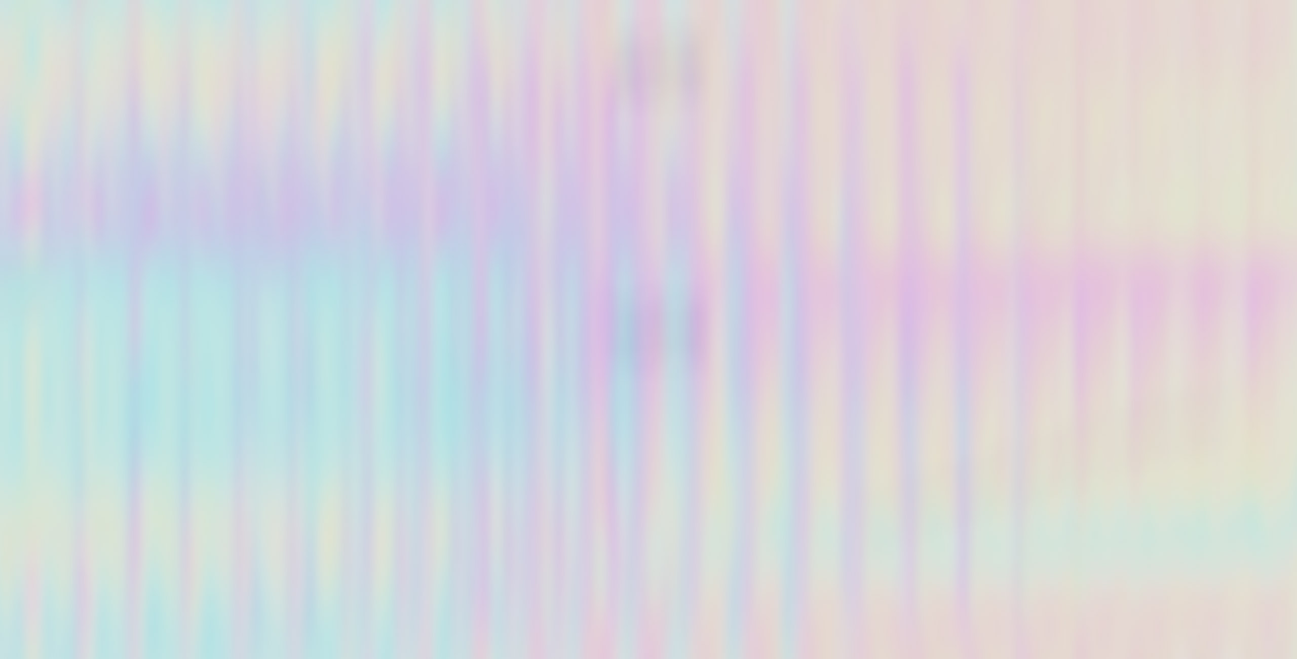 Top-down view of the Moonlight White Zephyrus G16, with a stylized anime drawing on screen and the RGB illuminated on the keyboard. 