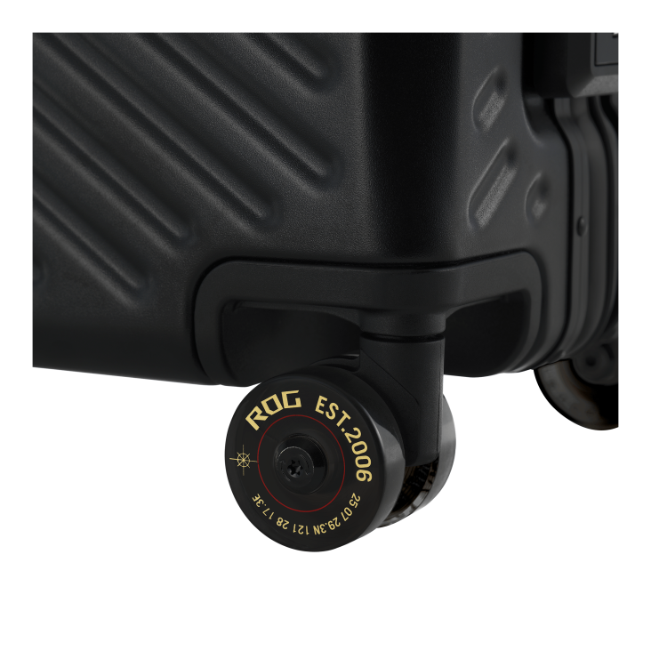 Close-up of two wheels at the bottom of a black suitcase, showing ROG EST. 2006 and coordinates