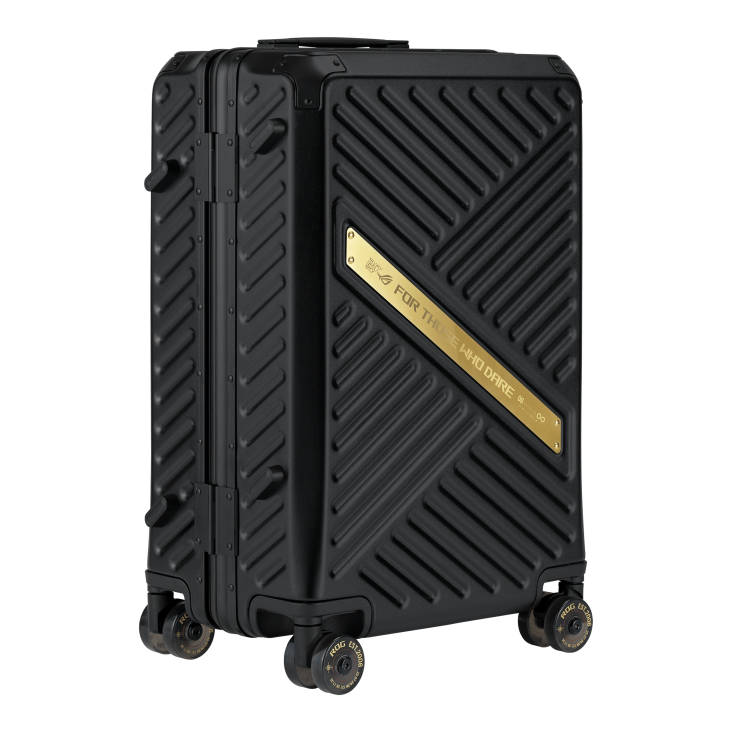 Right side of a sleek black ROG gaming suitcase with diagonal textured surface, featuring a gold ROG FOR THOSE WHO DARE plaque and branded wheels