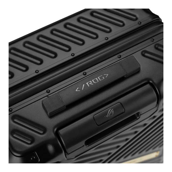Close-up of a black, textured gaming device or case featuring the text and ROG logo